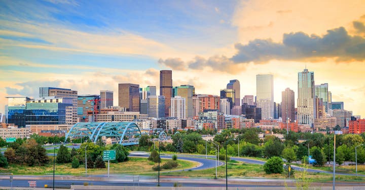 Skyline of Denver, Colorado in the evening sky. When you need storm, fire, or water damage services in your home or business, call SERVPRO